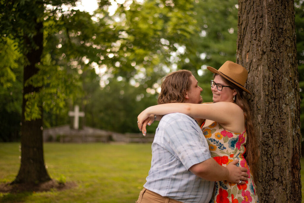 Leaning against tree