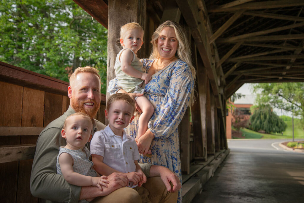 Posing on a covered bridge