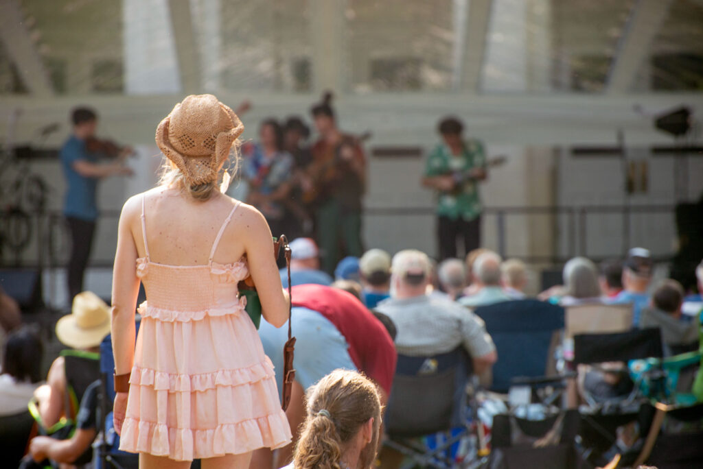 concert goer watches band play